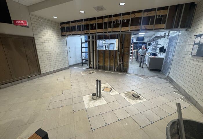 Restaurant remodel in progress with exposed framing during construction