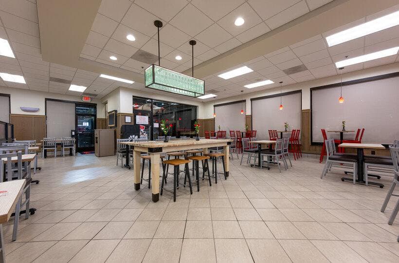 Renovated restaurant dining room with new seating, flooring, and lighting
